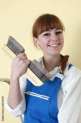 Photo: Decorator holding wallpaper brush Decorator holding wallpaper brush