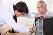 Photo: Technician repairing a computer Technician repairing a computer