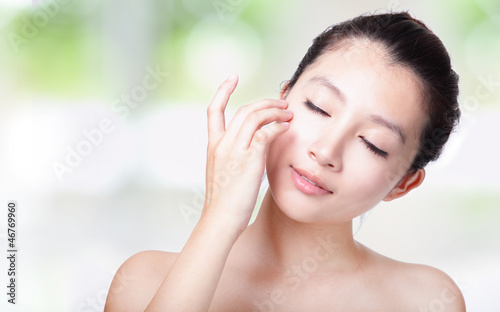 Photo: girl relax touch her eyes and face girl relax touch her eyes and face