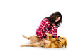 Foto: Woman tickling her dogs belly Woman tickling her dogs belly