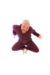 happy bald man jumping in his pajamas