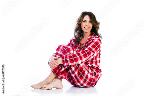 Photo: Pretty woman in flannel pajamas Pretty woman in flannel pajamas