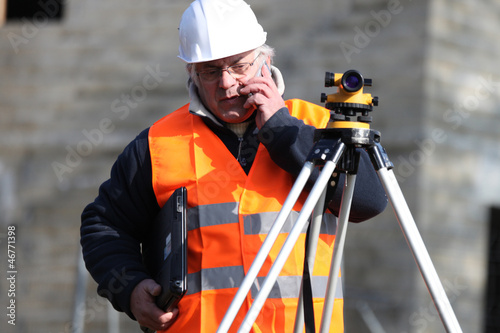 Photo: Man surveying site Man surveying site