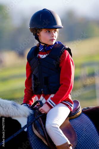 Photo: Horse riding - portrait of lovely equestrian on a horse Horse riding - portrait of lovely equestrian on a horse