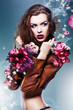 pretty attractive erotic woman in brown jacket with flowers