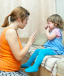 Woman scolds crying child