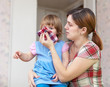 woman wipes snot her daughter