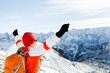 Hiking success, woman in winter mountains