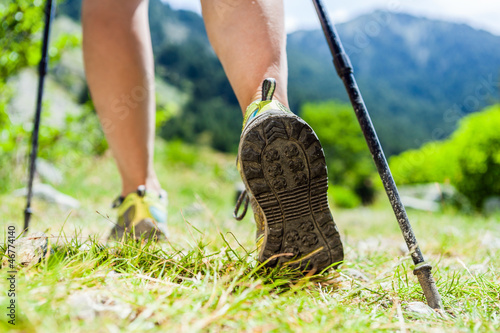 Photo: Nordic walking legs in mountains Nordic walking legs in mountains