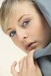 Blond woman wearing grey hood top