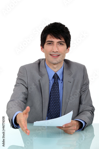 Photo: A businessman about to shake hand. A businessman about to shake hand.
