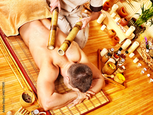 Photo: Woman getting bamboo massage. Woman getting bamboo massage.