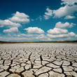 global warming. dramatic sky over cracked earth