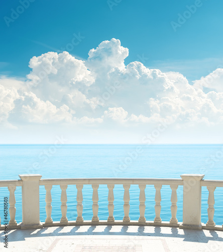 Photo: balcony near sea and clouds over it balcony near sea and clouds over it