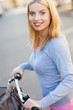 Portrait of woman with bike
