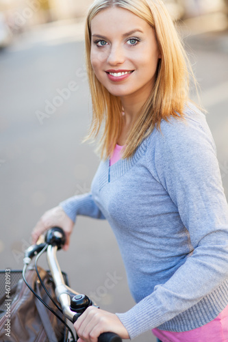 Photo: Portrait of woman with bike Portrait of woman with bike