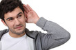 young man eavesdropping