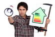Young man with bullhorn showing