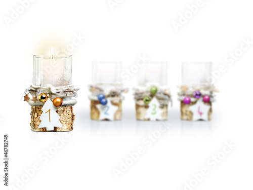 Photo: First Advent Candle on white background First Advent Candle on white background