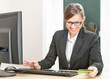 Photo: Business woman working on a computer Business woman working on a computer