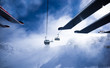 People are riding in chairlift