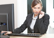 Photo: Business woman working on a computer Business woman working on a computer