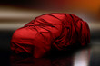 Mystery car covered with red satin textile