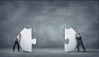 Piece of puzzle and business persons