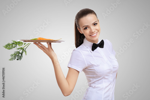 Photo: Waitress and carrot on the tray Waitress and carrot on the tray