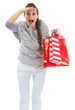 Woman in sweater with shopping bags looking into distance