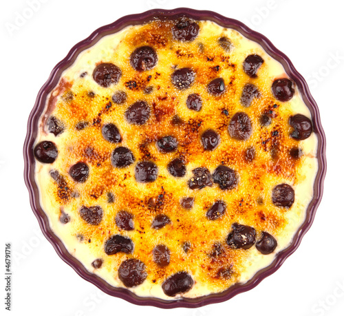 Photo: cream brulee with cherries isolated on white cream brulee with cherries isolated on white