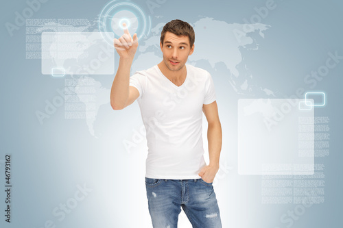 Photo: handsome man working with touch screen handsome man working with touch screen