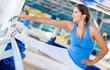 Gym woman stretching her leg