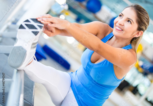 Photo: Athletic woman stretching Athletic woman stretching