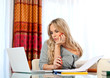 attractive woman writing on laptop
