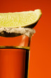 Small glass og tequila with lime