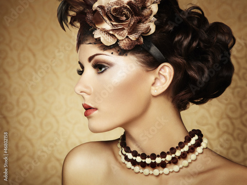 Photo: Retro portrait of a beautiful woman. Vintage style Retro portrait of a beautiful woman. Vintage style