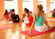 Practicing yoga at health club