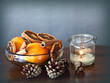 Simple Christmas: bowl with spices and fruits and a candle