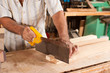 Photo: Carpenter with hand saw Carpenter with hand saw