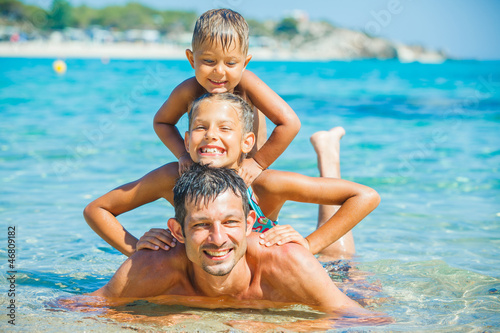 Photo: Family playing in the sea Family playing in the sea