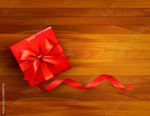 Vector: Holiday background with gift box and red bow. Holiday background with gift box and red bow.