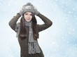 Young brunette woman in winter scenery