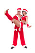 Happy young couple wearing santa claus clothes