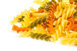 Uncooked pasta fusilli in different colours, white background
