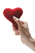Handmade red heart in a woman's hand