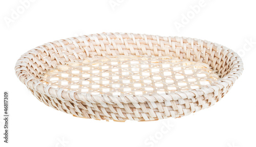 Photo: Wickerwork empty yellow breadbasket on white background Wickerwork empty yellow breadbasket on white background
