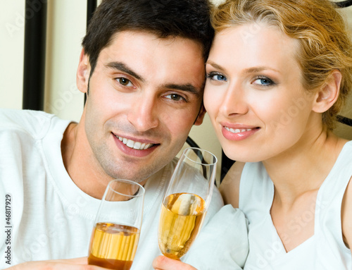 Photo: Cheerful couple with champagne Cheerful couple with champagne
