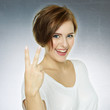 Happy successful woman showing ok