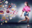 Escape. Running woman refuses to eating tasty cakes. Dieting